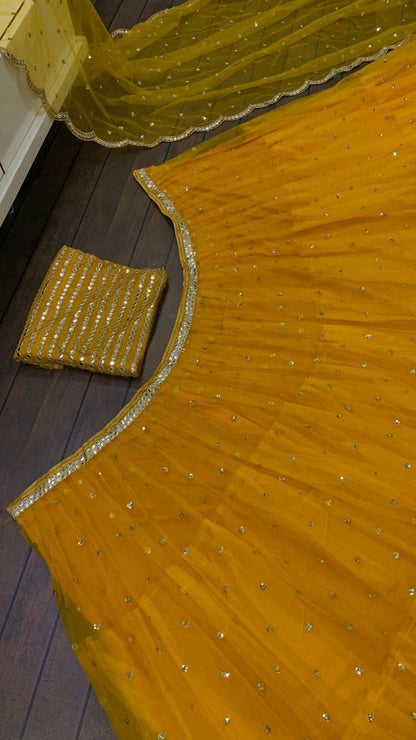 Yellow net sequence embroidery work ruffle lehenga choli for ceremony