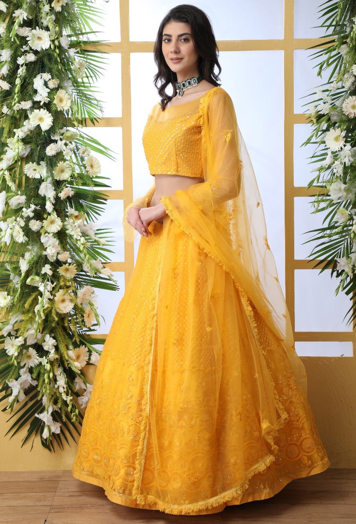 Yellow net thread and sequence embroidered wedding lehenga choli