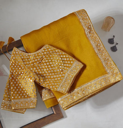 Yellow organza coading and sequence work wedding saree