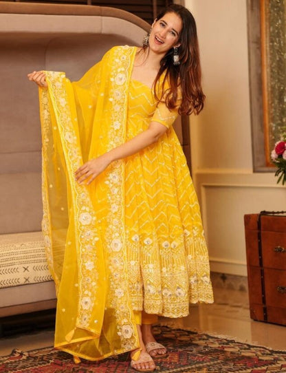 Yellow organza emboroidered anarkali suit for ceremony