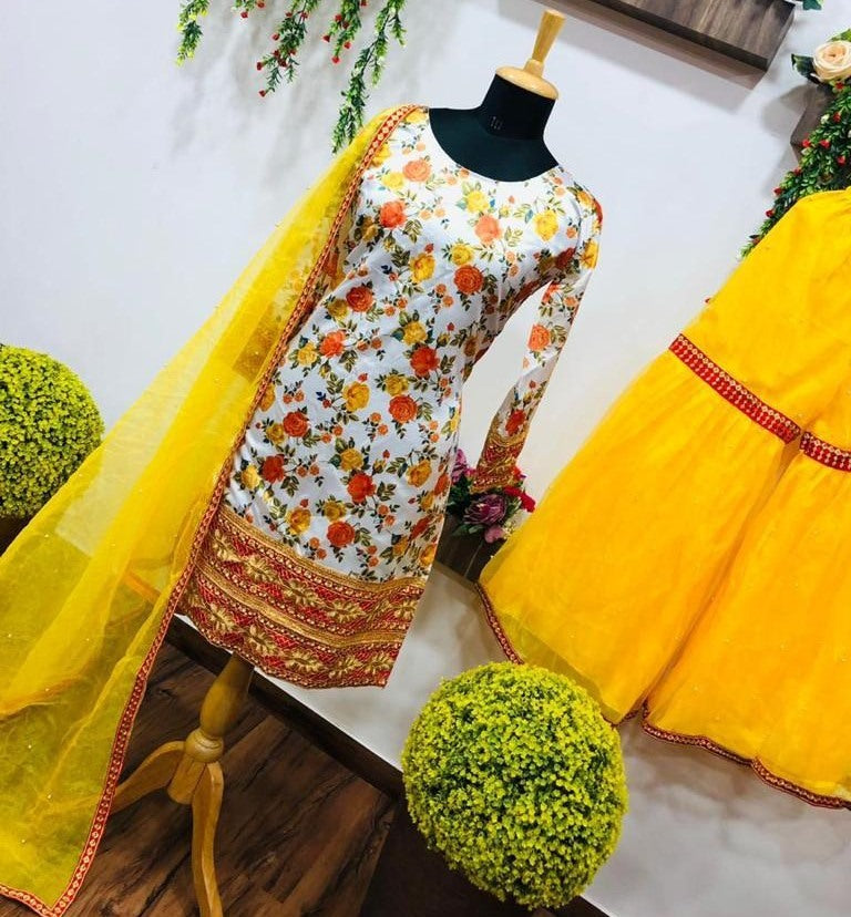 Yellow print and embroidered sharara suit for haldi ceremony