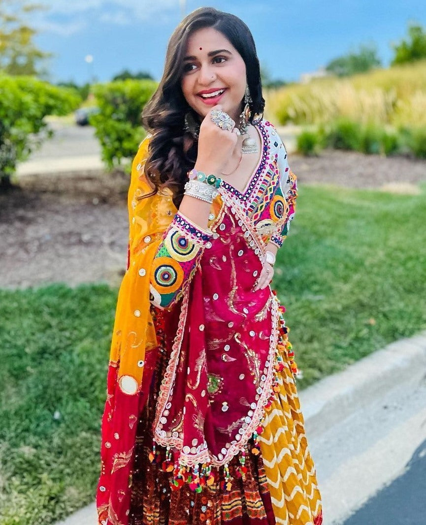 Yellow print mirror work kinjal dave gujarati garba navratri chaniya choli
