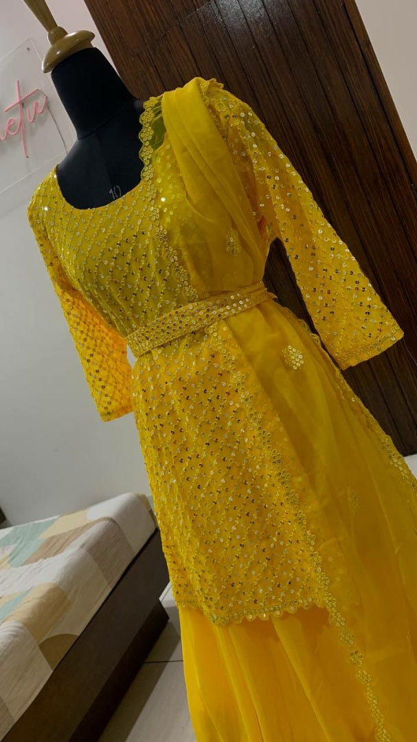 Yellow sequence work lehenga with long choli