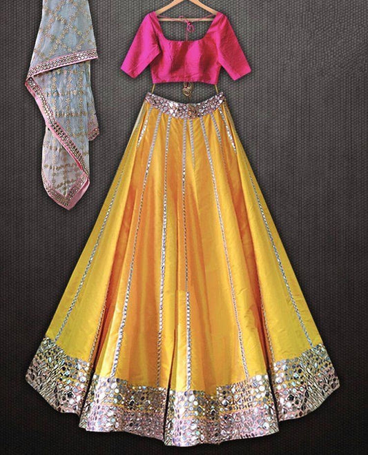 Yellow tapeta silk foil mirror work lehenga choli for ceremony