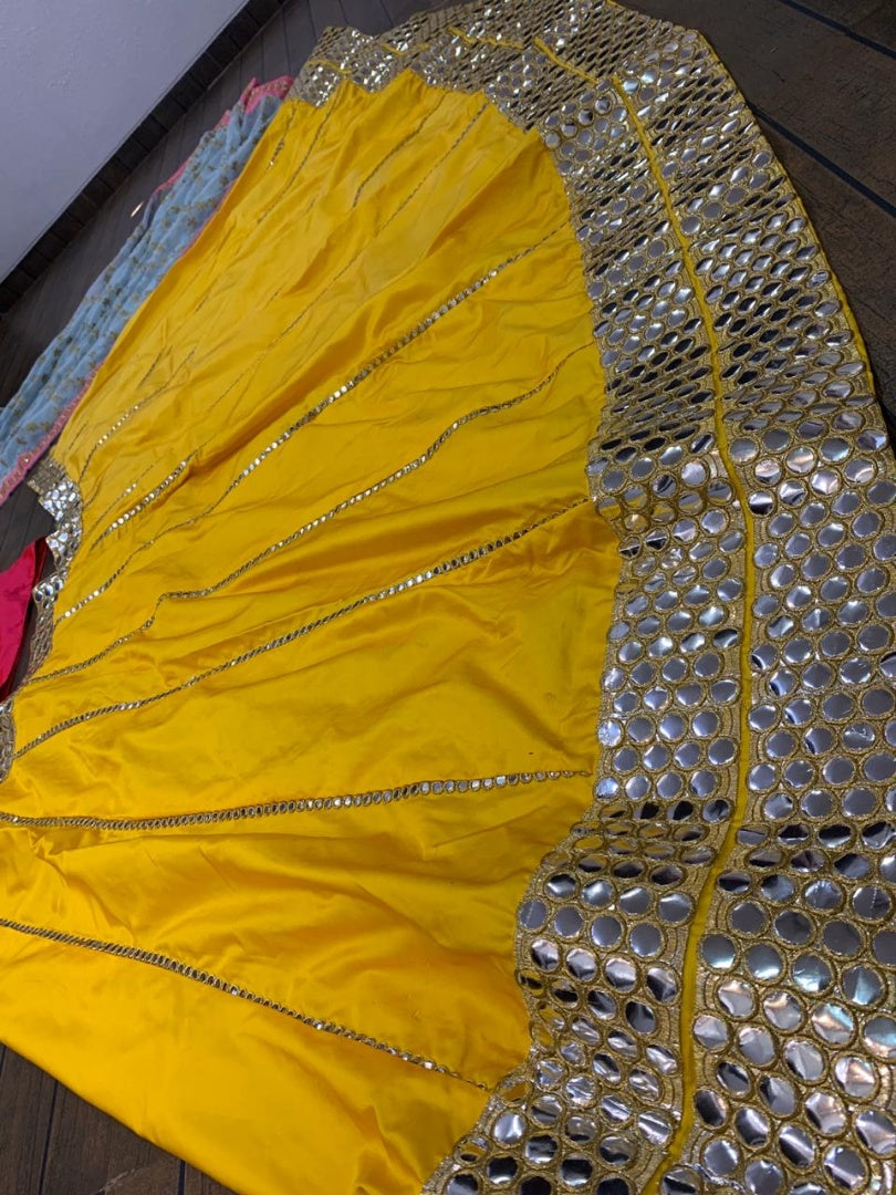 Yellow tapeta silk foil mirror work lehenga choli for ceremony