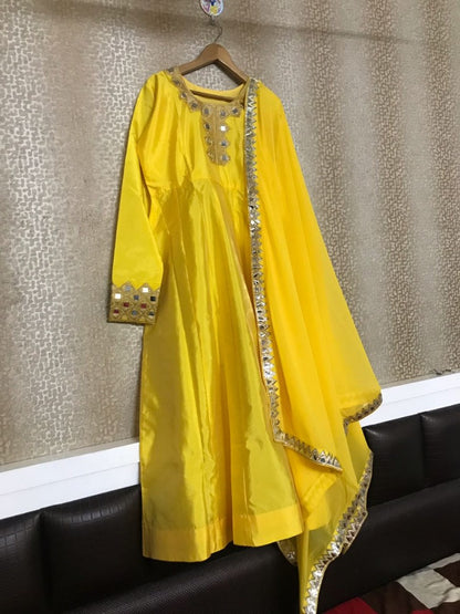 yellow tapeta silk mirrow worked anarkali suit