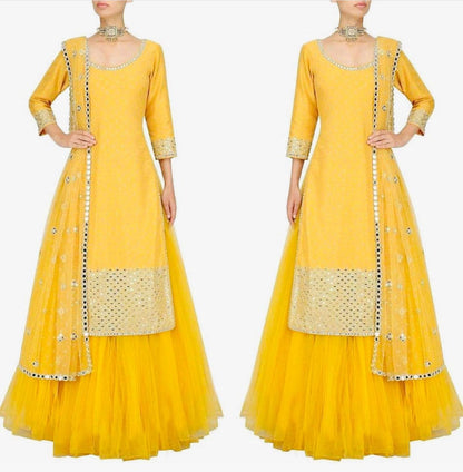 Yellow tapeta silk with foil mirror work suit lehenga